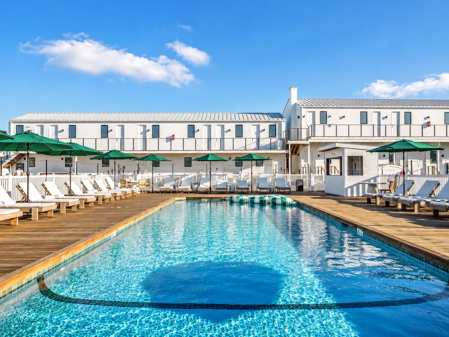 Exterior pool deck at Offshore Montauk, a boutique waterfront hotel and resort in Montauk, New York.